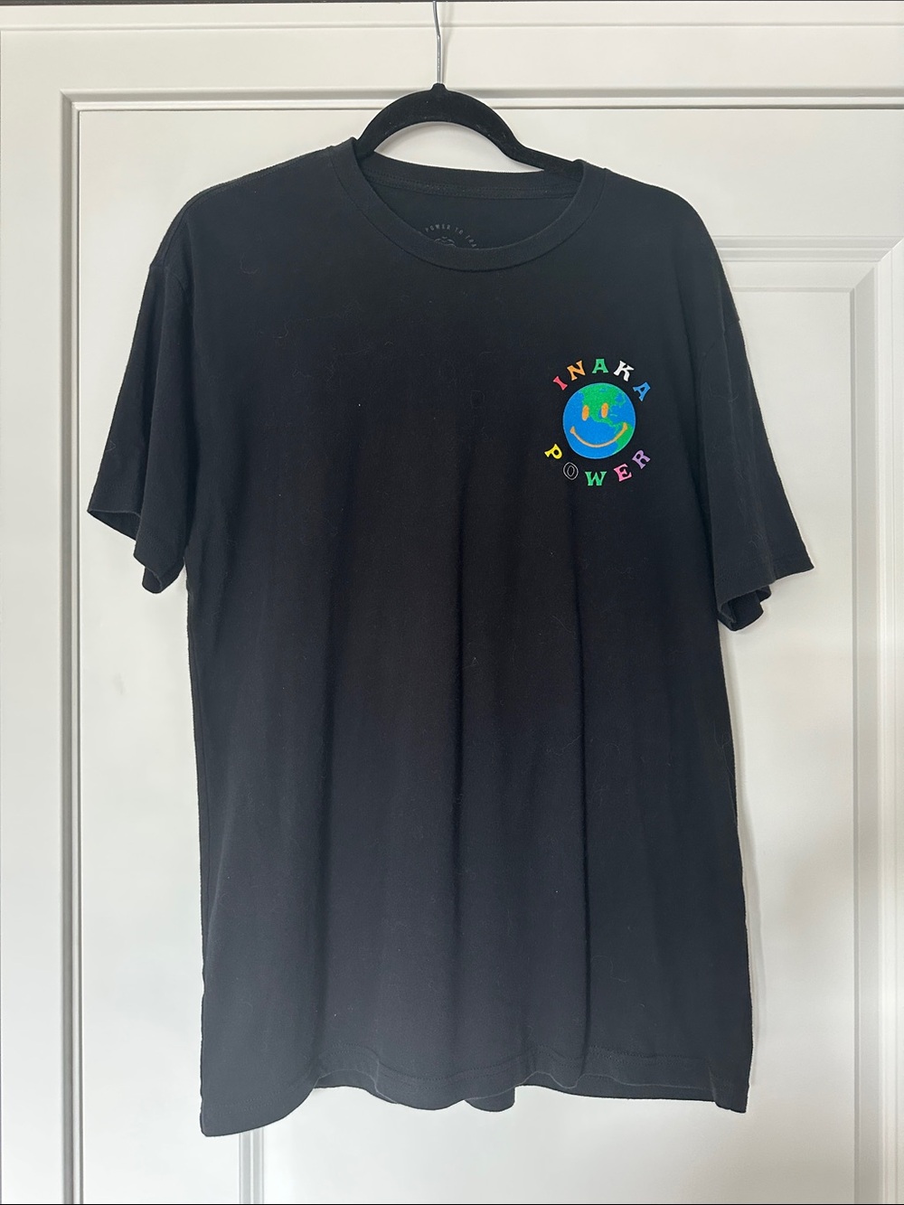 Inaka Power Black Tee with Rainbow Smile Logo